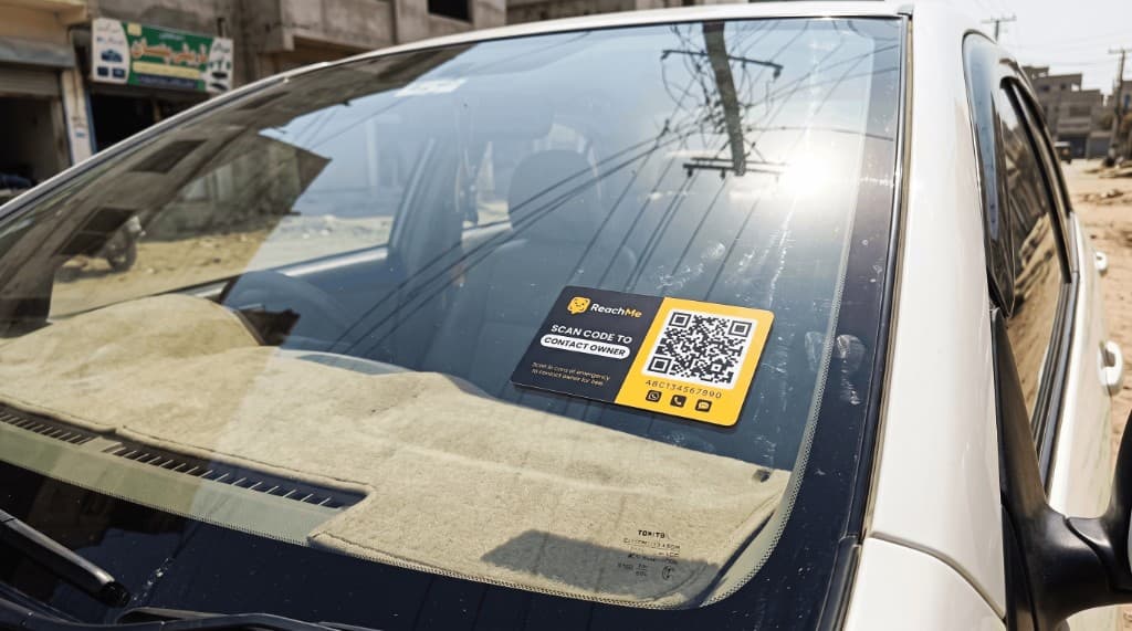 ReachMe privacy tag displayed on a car